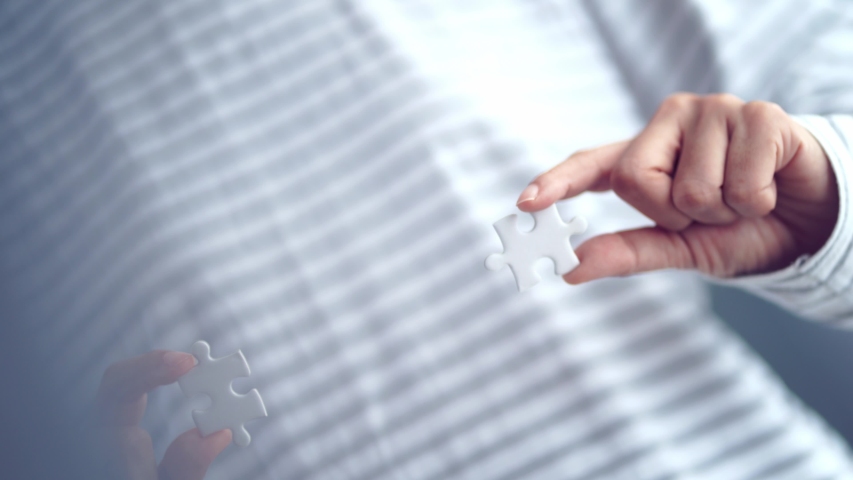 piece of jigsaw connecting together by hand, step of success concept