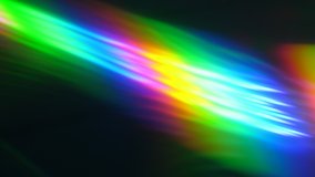 Colorful Light Beam and Ray on Black Background. Abstract Background Rainbow on CD. Beautiful Color Lens Light Rainbow Beam for Movie and Cinema at Night. Prism Separating Ray Into Colors of Spectrum. - Powered by Shutterstock - Get 15% off with code: PIKWIZARD15