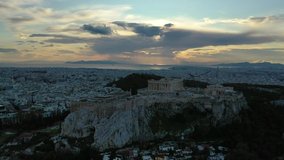 Aerial drone video of iconic Acropolis hill and the Parthenon at dusk with beautiful sky and colours, Athens, Attica, Greece
