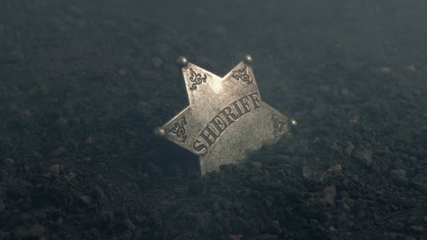 Sheriff Badge In The Ground With Smoke Blowing Over It