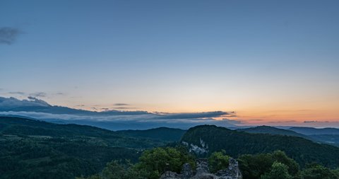 Time lapse of clouds and sunrise in the mountains, Formation of cumulus clouds, beautiful summer landscape