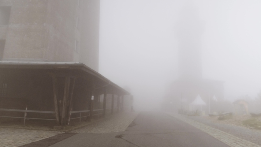 View of Towers and Estate Covered in a Heavy Mist at Grosser Feldberg, Frankfurt, Hessen, Germany