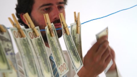 Businessman Making USD Dollar Money Laundry in White Background Studio
