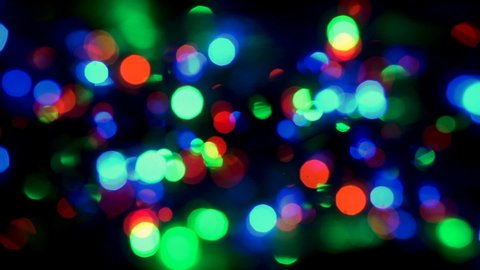 Multi-Color Glare.This is stock motion graphics, that show countless multi-color bokeh highlights rotating in two different directions.
