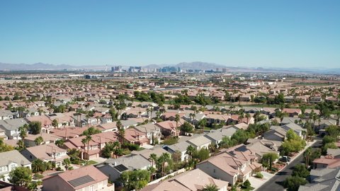Aerial view of Las Vegas suburban homes, housing with city skyline in background