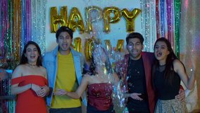 Crazy young friends celebrating New Year's Eve together at a house party in India. Excited Indian boys and girls in trendy party wear, shouting Happy New Year under falling confetti - celebration c... - Powered by Shutterstock - Get 15% off with code: PIKWIZARD15