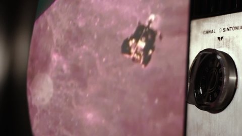 Apollo 11 Moon Landing on a Retro TV. Side View. Zoom In. Elements of this Video furnished by NASA. 