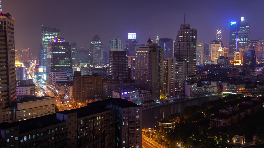 Shanghai urban cityscape aerial skyline panorama timelapse at night zoom out