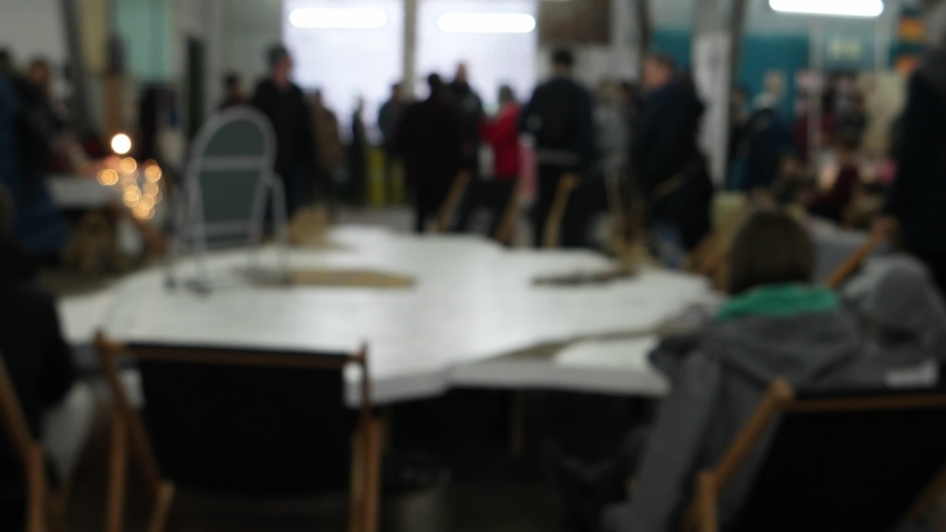 Visitors walk around the mall before the Christmas holidays, background, blurry