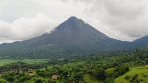 Aerial landscape of Arenal Volcano, Costa Rica. Extreme long shot, tracking to the right.
