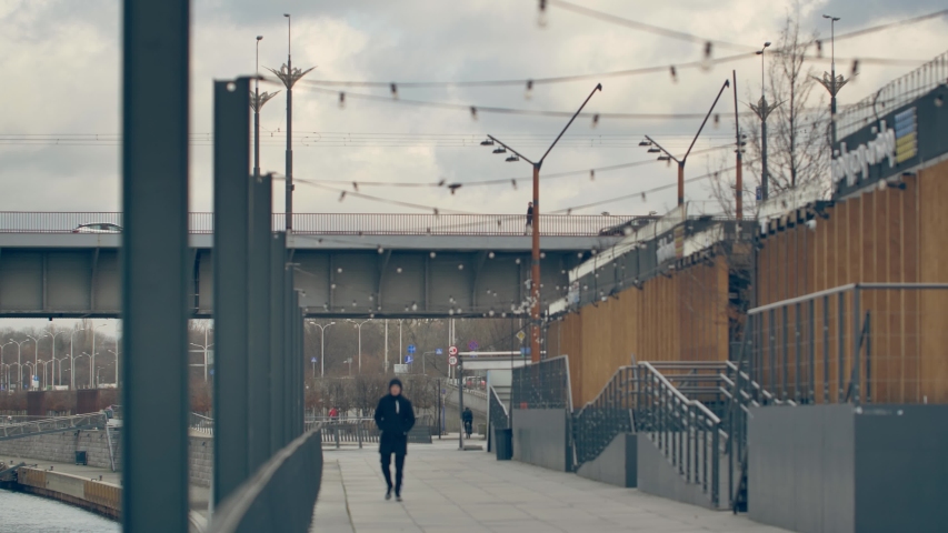 Unrecognizable people on the promenade. 