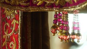 Sikh Wedding Preparation with Close Up of traditional costume with jewelry from the Lengha Kaleere - Powered by Shutterstock - Get 15% off with code: PIKWIZARD15