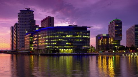 manchester 01/10/2019: Salford Quays timelapse from sunset to night pan England UK