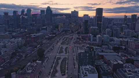Aerial flying over the Montreal City Skyline sunset. Montreal, Quebec, Canada. 