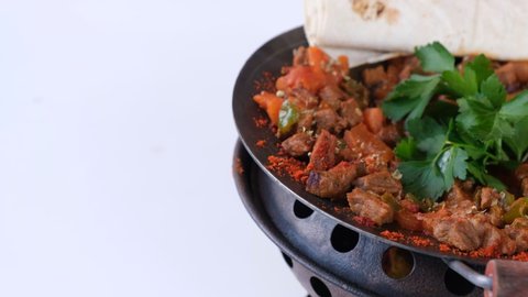 Turkish food, delicious meat saute in traditional pan - Sac Kavurma