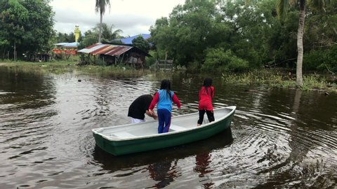 images Bailing Water Out Of A Boat people bailing water out of stock