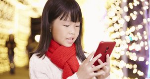 asian girl give eldership chinese new year greeting with video by smartphone