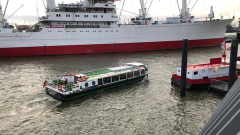 Hamburg, Germany - December, 9 2019:Ferries and ship at Hamburg port, one of the largest ports in Europe.