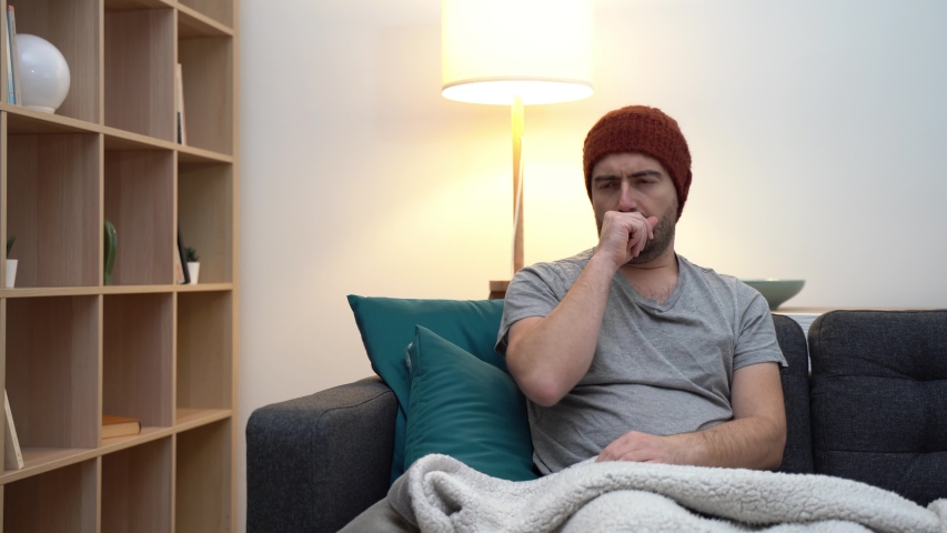 Video about one man suffering cold and flu at home | Shutterstock HD Video #1042987348