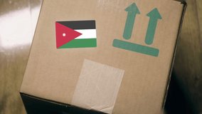 Warehouse worker places sticker with flag of Jordan on the box. Jordanian import or export related clip - Powered by Shutterstock - Get 15% off with code: PIKWIZARD15