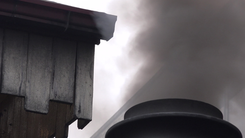 Smoke coming out of steam train chimney close up shot UK 4K
