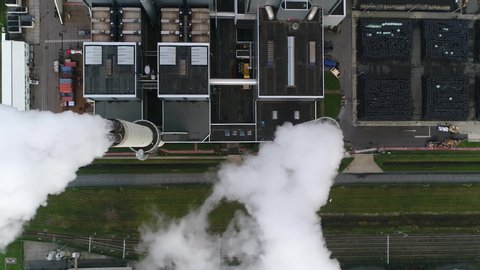 Aerial satellite view of coal fired power station is a thermal plant which burns a fossil fuel to produce electricity by converting heat of combustion into mechanical energy 4k high resolution