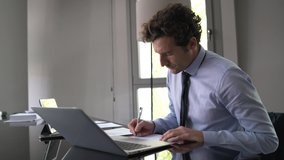 Businessman working on laptop meeting room