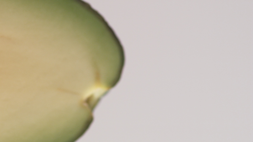 Camera follows pouring oil over cut avocado. Slow Motion. Royalty-Free Stock Footage #1043020531