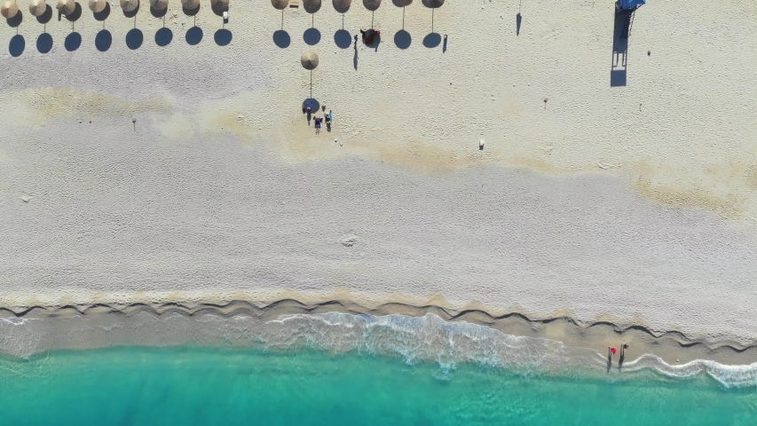 Top down aerial view, flight over the beautiful Myrtos Beach in the Ionian Sea on Kefalonia, Greece. Slider shot