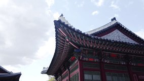 Scenic slow motion video of beautiful old building in palace in capital of Republic of Korea Seoul. Beautiful summer sunny look of construction in asian style in largest city of South Korea.