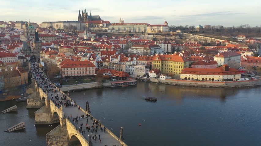Aerial view of Charles Bridge and Prague Castle at sunset light in desember Prague, Czech Republic