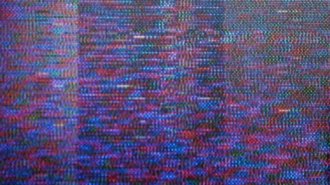 VHS defects, noise and artifacts, glitches from the old VHS tape.