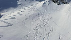 4k aerial footage with ski mountaineers competing during a ski touring and mountaineering race