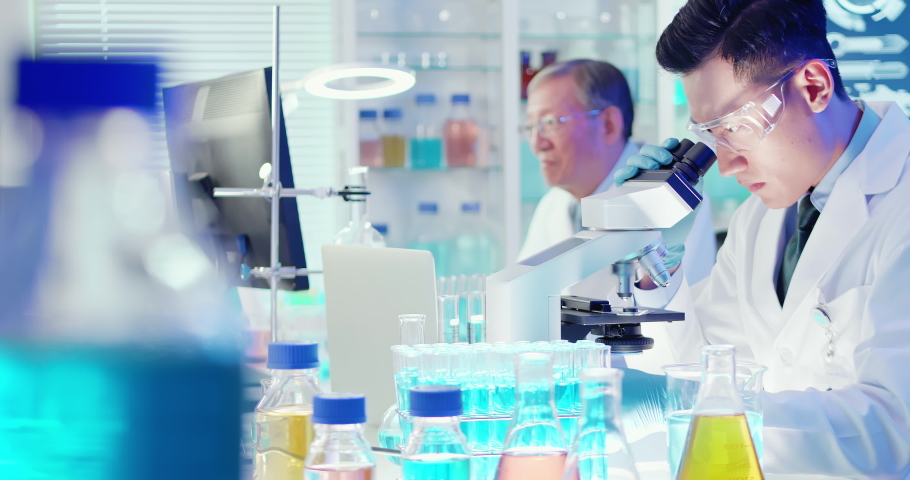 Asian scientist team use microscope in the laboratory | Shutterstock HD Video #1043045380
