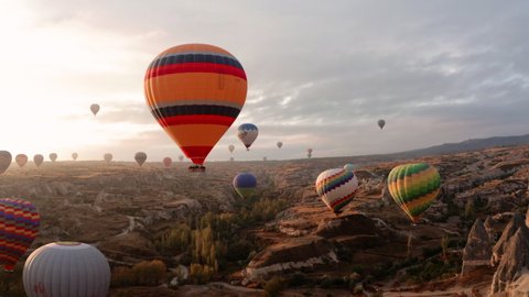 A balloon flies over Cappadocia, shooting from a drone in 4K
