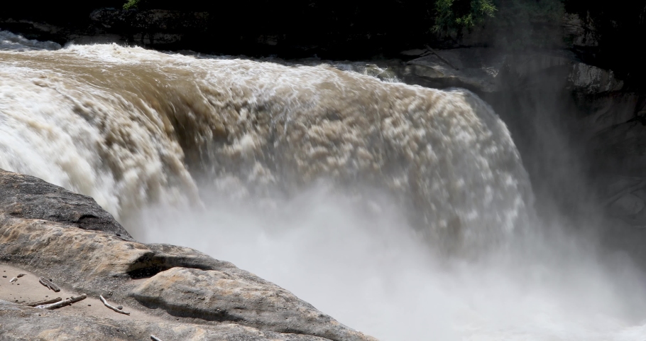 Water plunging with power over Cumberland Falls, a waterfall on the Cumberland River in Kentucky, USA, is displayed in this seamless loop.