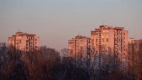 Short time lapse of a sunset with old communist architecture buildings above bride park during winter in Zagreb, Croatia in 4K