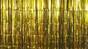Shimmering golden foil tinsel fringe background for stage, New Years, birthday, wedding, or any celebration, pary or event - Powered by Shutterstock - Get 15% off with code: PIKWIZARD15