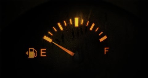 Fuel Gauge Car Dashboard Fills up. Orange Light Turn Off when Tank is Full or Vehicle Activated. Close Up petrol meter on black background, Horizontal video clip in 4K. Gasoline Prices and Tax concept