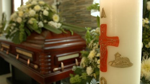 Coffin with flowers in the funeral service alone.