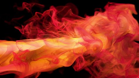 Yellow red color paint ink drops in water slow motion art background with copy space. Inky cloud swirling flowing underwater. Abstract smoke fluid liquid animation isolated on black alpha matte