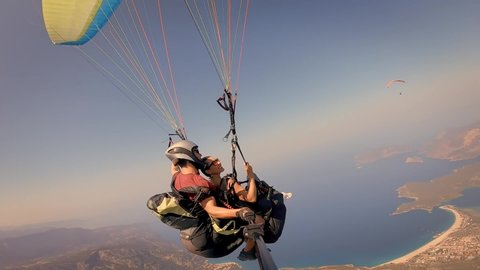 Flying on a paraglider. View of the coast from a height.