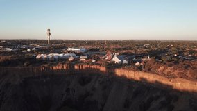 4K high quality sunny sunrise morning aerial panorama footage of spectacular scenic The Big Hole old diamond mine site, mine shaft towers in Kimberley, capital of Northern Cape province, South Africa