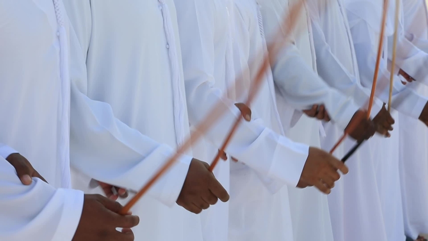 Traditional Emirati Yawalah male dance, UAE heritage, hands in frame | Shutterstock HD Video #1043248111