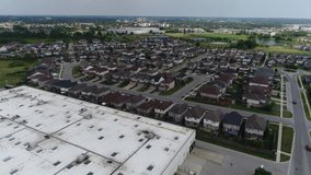 Retail Outlet Rooftop Aerial Towards Brand New Suburban Subdivision In Background