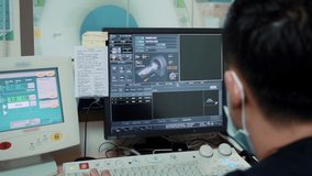 The doctor watches the results of MRI examinations of the patient on the monitor of the computer, on which the internal organs of the person are shown - Powered by Shutterstock - Get 15% off with code: PIKWIZARD15