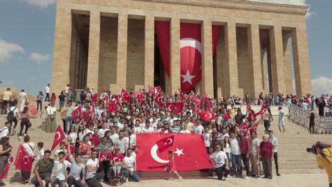 Ankara, Turkey - August 2019: Turkish people with Turkish flags infront of Anitkabir Mausoleum of Ataturk, the Great Leader Ataturk in his grave to convey his love and respect.