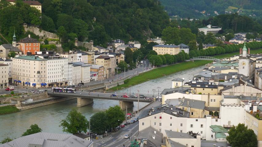 sunset time salzburg city center riverside downtown traffic bridge hilltop panorama 4k austria