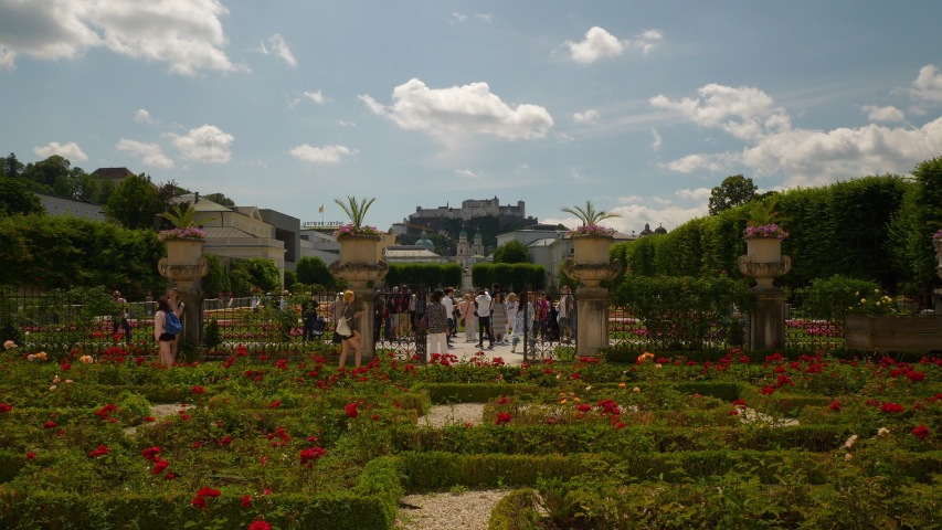 sunny day salzburg city famous tourist crowded garden castle view slow motion panorama 4k austria