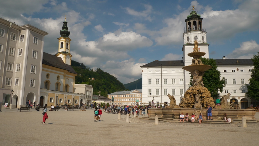 day time salzburg city center famous crowded central square slow motion panorama 4k austria